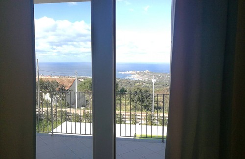 Paduledda Apartment | Comfortable one-bedroom apartment with wide sea view, shared pool and parking space