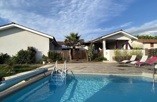 Saint-Vincent-de-Paul Bed & Breakfast | Comfortable room with swimming pool, bathroom and wc.