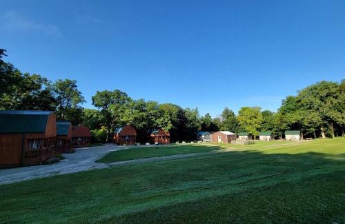 Moscow House | Comfortable Camping Cabins with View of the Cedar River for a Family Weekend Getaway