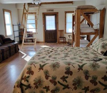 Moscow House | Comfortable Camping Cabins with View of the Cedar River for a Family Weekend Getaway