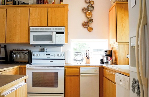 Olympia Apartment | Complete apartment with separate entrance, sunroom, paddle boards, kayaks, etc.