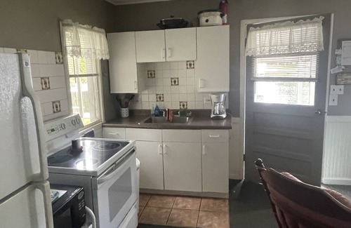 Ludington Cottage | Cottage 2 is a 2 bedroom 25’ from its boat dock & Hamlin Lake