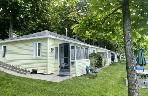 Ludington Cottage | Cottage 2 is a 2 bedroom 25’ from its boat dock & Hamlin Lake
