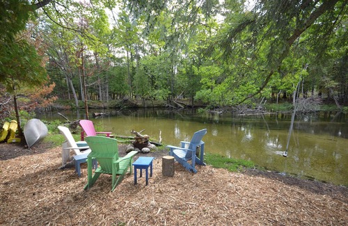 Glen Arbor House | Cottage in Glen Arbor with Crystal River frontage, Canoe, FP, A/C, Dogs ok
