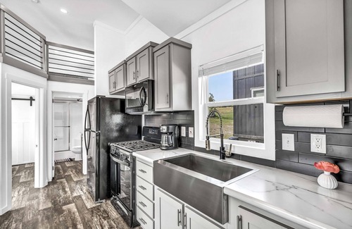 Brenham Cottage | Cottage with Loft - Pet Friendly - Includes 3 queen beds (one in master and 2 in loft), a fully equipped kitchen, dining area, private bath and shower, TVs, Wifi, all utilities, access to all resort amenities. This cottage is pet friendly.
