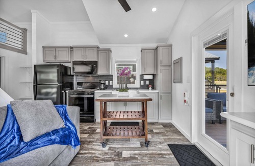 Brenham Cottage | Cottage with Loft - Pet Friendly - Includes 3 queen beds (one in master and 2 in loft), a fully equipped kitchen, dining area, private bath and shower, TVs, Wifi, all utilities, access to all resort amenities. This cottage is pet friendly.