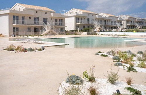 Pachino Apartment | Cozy 40 sqm seaview flat, able to accommodate up to 3 people, located inside the renowned Borgo 84 residence, equipped with swimming pool and cycle path. The property is located just 3 km from the center of Marzamemi, one of the most fascinating seaside