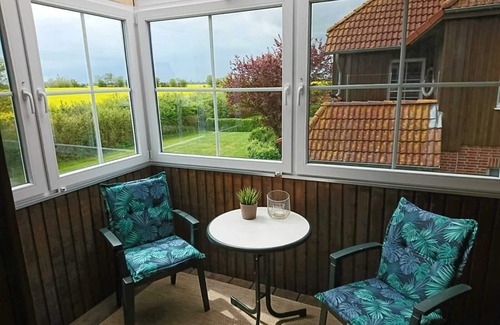 Wenkendorf Condo | Cozy, bright vacation apartment on 2 levels with conservatory