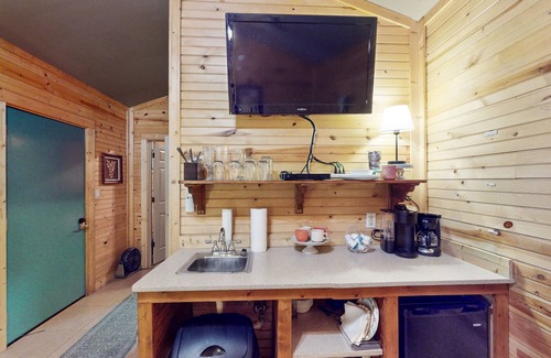 Paige Cabin | Cozy cabin w/covered porch, relaxing hammock & porch swing