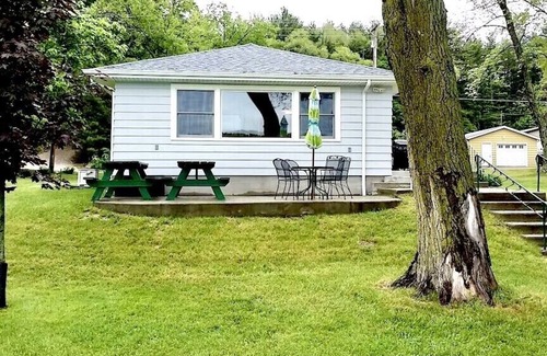 Angola Cottage | Cozy Classic Cottage Right on The Water + Private Dock