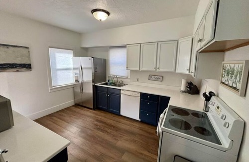 Sioux Falls House | Cozy home near Premier Center, Downtown & Sanford: 65"TV & Fenced Yard-Sleeps 7