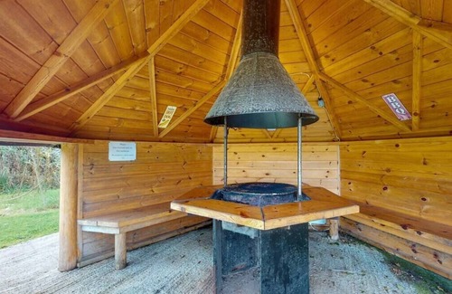 Llanfairpwllgwyngyll Cabin | Cozy Hot Tent with Log Burner & Hot Tub Right Tent
