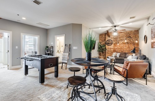 Greenville Downtown Apartment | Cozy Industrial 2-KING Bdrm S. Main Street Downtown Condo w/Foosball Table