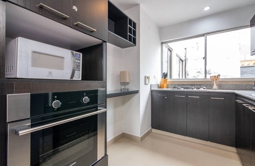 Astorga Apartment | Cozy Penthouse next to Poblado Park with Large Balcony and A/C