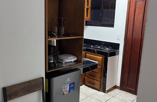 Banos de Agua Santa Apartment | Cozy suite with kitchen and private bathroom. 5 minutes from downtown