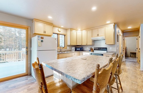 Presque Isle House | Cozy tree-lined home located near town, lakes, walking & bike trails, w/firepit