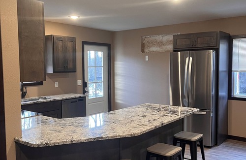 Bemidji House | Cozy two level home - 2 minutes from beach on private wooded lot.