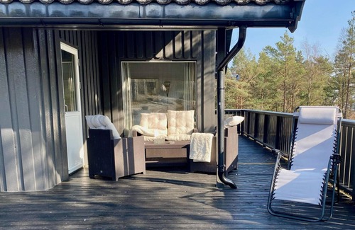 Arendal Cabin | Cozy vacation home in southern Norway (Tromøy, Arendal) with a boat and a pier.