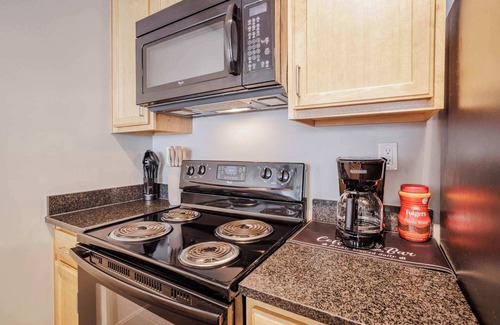 Central Business District Apartment | CozySuites at the Banks gym, pool 11