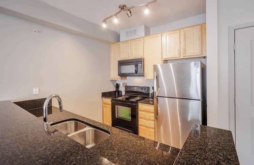 Central Business District Apartment | CozySuites at the Banks gym, pool 11