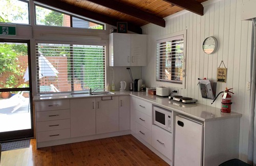 Cranley Cottage | Cranley Garden Retreat with Fireplace & Pool