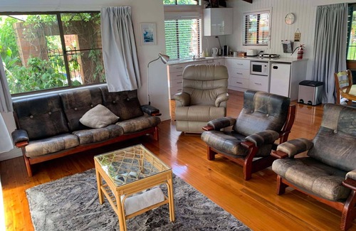 Cranley Cottage | Cranley Garden Retreat with Fireplace & Pool