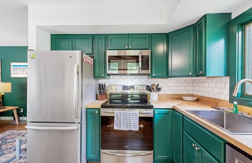 Waitsfield Condo | Creekside condo with pool, next to Catamount Trail on river with water views