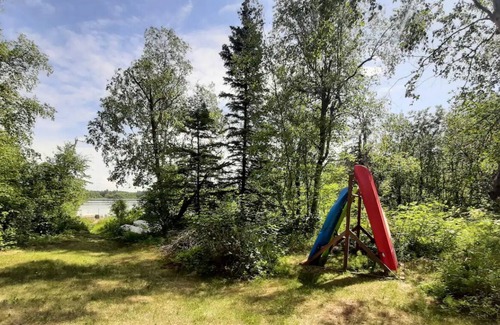 Tanaina Cabin | Custom built modern cabin with a loft on a lake with mountain views.