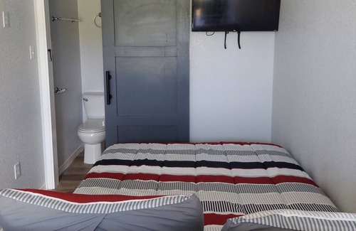 Brazoria Cabin | Custom Container Home w/ walk-in shower and patio! Walking distance to the river