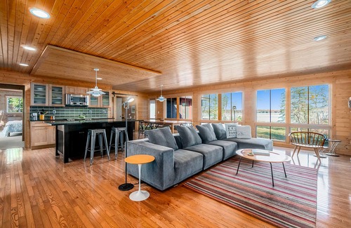 Lake Township House | Custom-designed lake house with screened porch, deck, Ping-Pong & lawn games