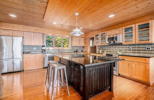 Lake Township House | Custom-designed lake house with screened porch, deck, Ping-Pong & lawn games