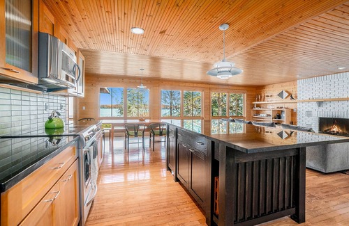 Lake Township House | Custom-designed lake house with screened porch, deck, Ping-Pong & lawn games