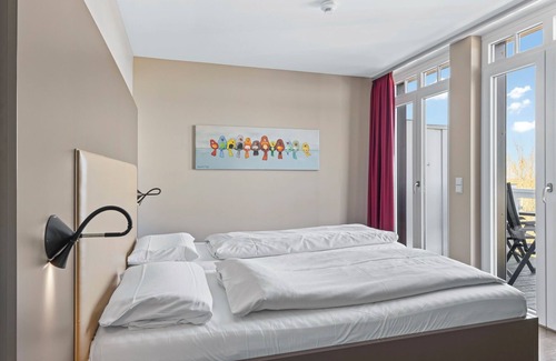 Wremen Apartment | Dachgeschosswohnung in Strandnähe mit Sauna, Zwei Balkonen und Tollem Ausblick