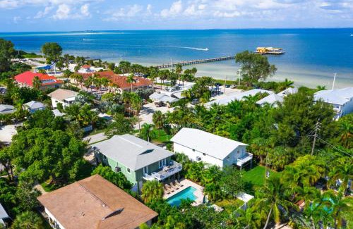 Anna Maria House | Decked Out - Stunning Home Huge Sunny Resort Style Heated Pool Walk to Pine Ave Beach