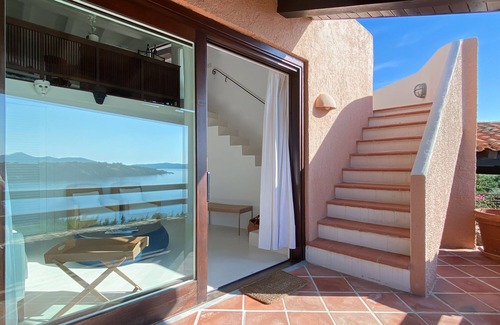 Porto Rotondo Apartment | Designer apartment overlooking the bay. Shared pool, access to the sea