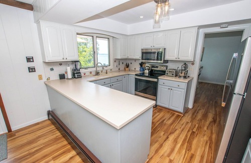 Suttons Bay House | Direct waterfront on West Grand Traverse Bay! Overlooking deck