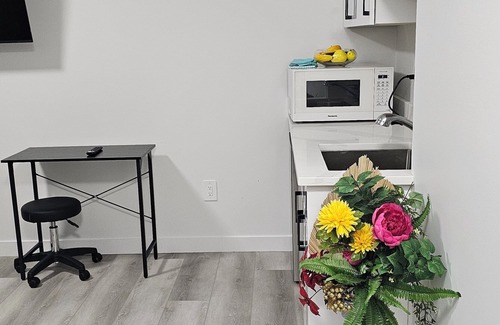 Saskatoon Apartment | "Discover Dominion's Crib! This chic and cozy space is ideal for travelers.