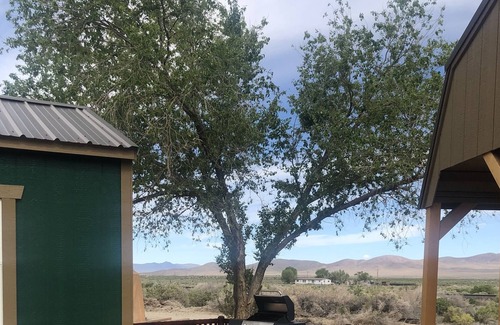 Imlay Cabin | Doc Holliday, has a double bed, sleeps 2 and has a detached private bathroom.