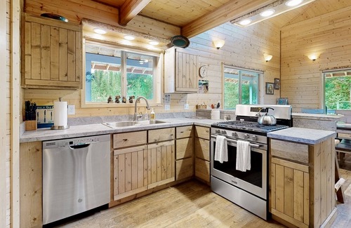 Elk City House | Dog-friendly riverfront home near town with deck, water views, & fireplace
