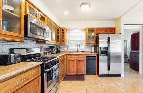 College Green Estates House | Dog-friendly updated home with enclosed yard, smart TVs, firepit, grill, & games