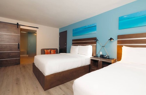 Harbor Hotel | Double Queen Comfort | Lounge, Heated Pool & Long Beach Dining Nearby