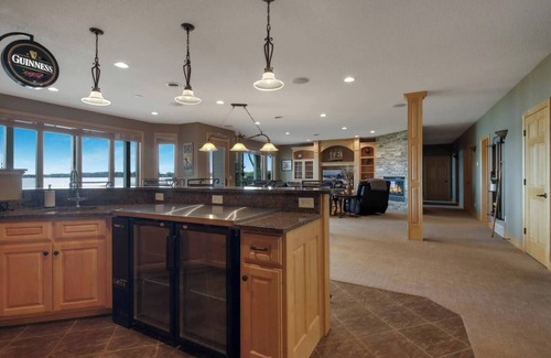 Chetek House | Downtown Lakefront Home on Lake Chetek w/hot tub & pontoon & jet ski rental