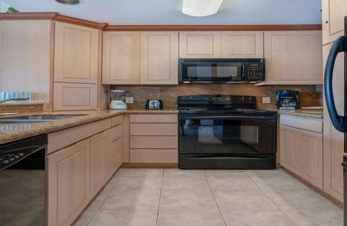 Lihue Condo | East Kauai OV Bliss! Open Kitchen, Lanai, WiFi, TV, DVD+Ceiling Fans–Kaha Lani 321