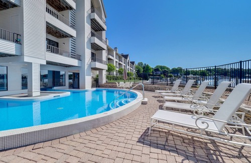 Charlevoix Condo | Edgewater Inn Condo #117C with Waterfront Access | Pool, Hot Tub, Sauna