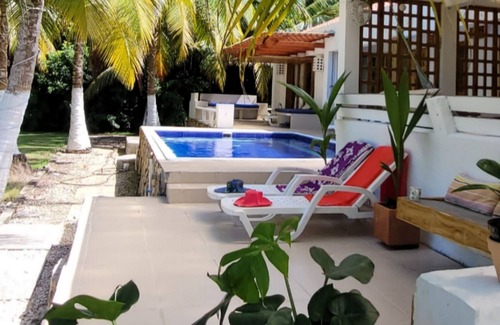 Monitos House | El Laguito Beach House, Pool and Beach Kiosk.