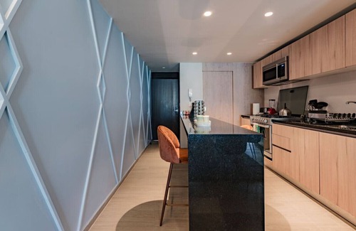 Del Valle Apartment | Elegant Apartment with Balcony and City Views