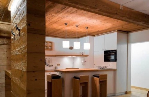 Sankt Moritz-Bad Ski Chalet | Elegant Golden Chalet in a Prime Location