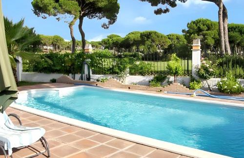 Nuevo Portil Villa | Elegant Villa in Nuevo Portil with Shared Pool