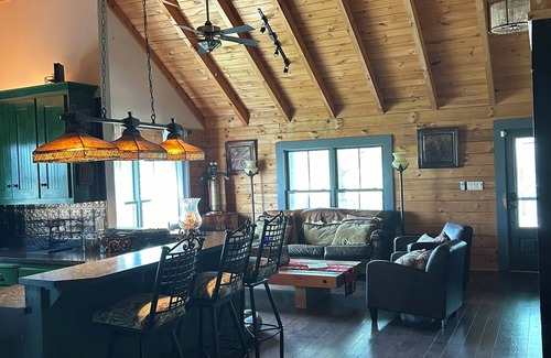 Ray County House | Enchanting cabin offers the perfect blend of rustic charm & modern luxury.
