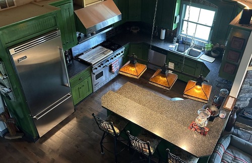Ray County House | Enchanting cabin offers the perfect blend of rustic charm & modern luxury.